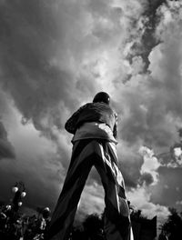 Low angle view of statue against sky