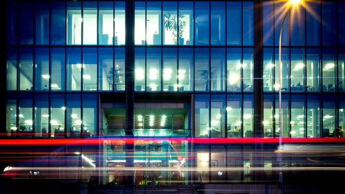 Reflection of illuminated buildings on window