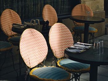 Empty chairs and tables in cafe