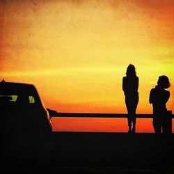 Silhouette of woman at sunset