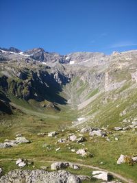 Scenic view of rocky mountains against clear blue sky