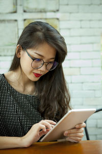 Young woman using mobile phone