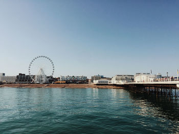 Worthing seafront ferris wheel in front of the beach and the see