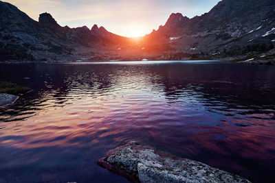 Scenic view of lake against sky during sunset