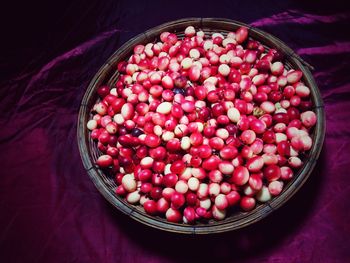 High angle view of strawberries in basket on table