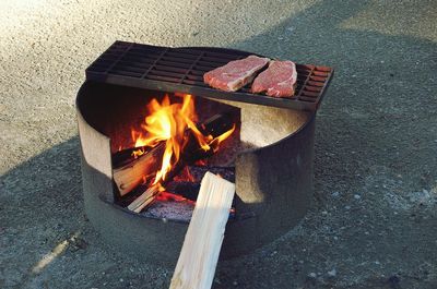 Wood burning stove on footpath