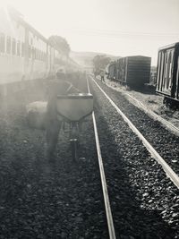 Train on railroad tracks against sky