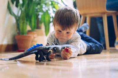 Boy lying down on floor