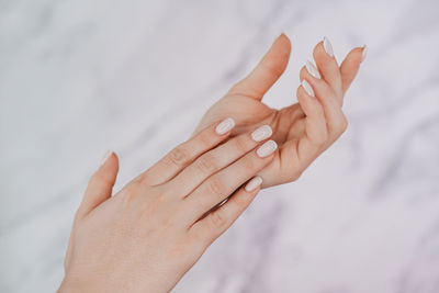 Cropped hand of woman holding hands