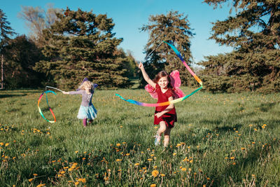 Full length of children playing on field