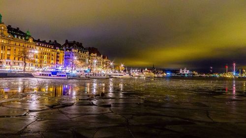 Reflection of illuminated buildings in water