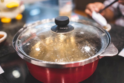 Boiling soup in sukiyaki pot.