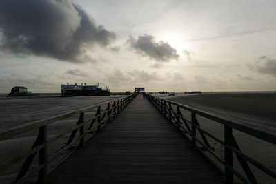 Pier over sea against sky