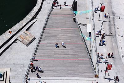 High angle view of people walking on floor in city