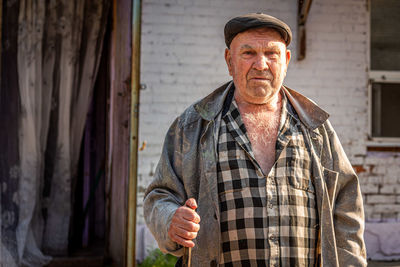 Portrait of man standing outdoors