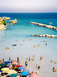 High angle view of people on beach against sky