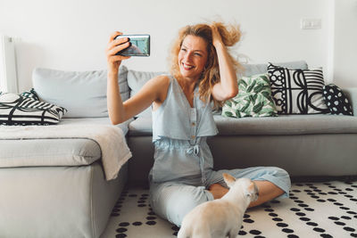 Young woman using phone