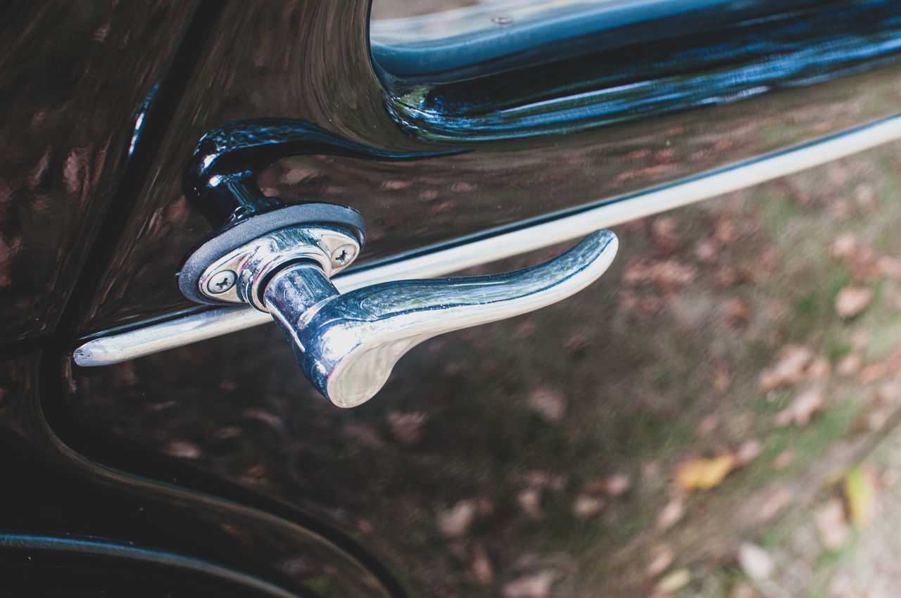 CLOSE-UP OF VINTAGE CAR WINDOW