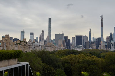 Buildings in city against sky