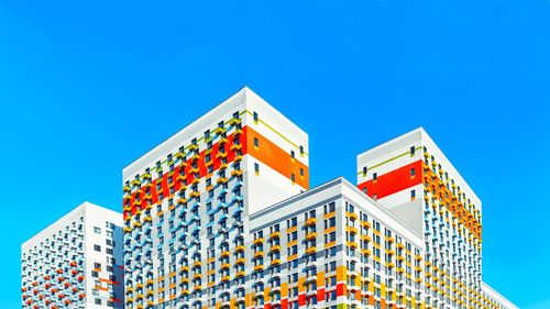 Low angle view of building against clear blue sky