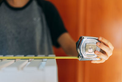 Close-up of man holding camera