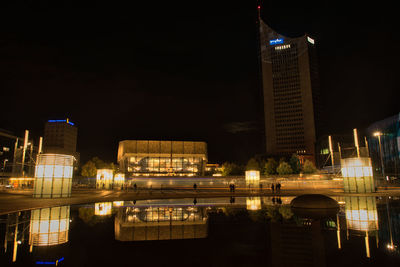 Illuminated buildings in city at night