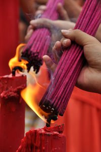 People burning incense sticks
