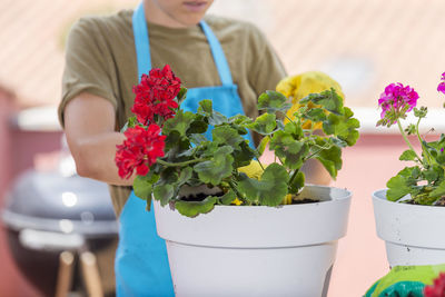 Midsection of woman holding bouquet