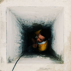 High angle view of man in hole