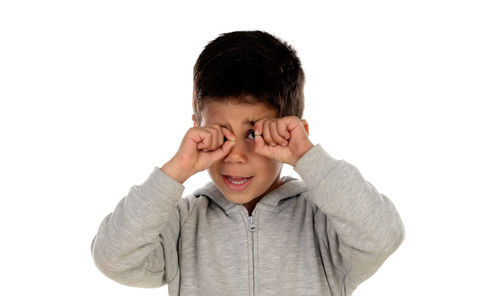 Portrait of smiling boy against white background