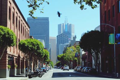 City street amidst buildings against sky