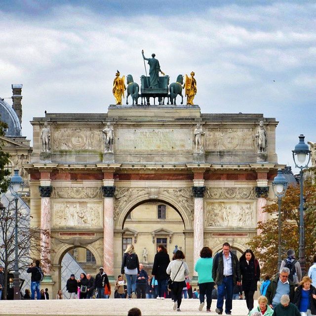 architecture, built structure, building exterior, sky, person, large group of people, men, cloud - sky, tourist, lifestyles, leisure activity, famous place, tourism, travel destinations, history, walking, cloud, mixed age range, travel