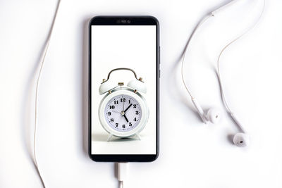 Close-up of clock on white background