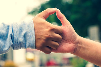 Close-up of man hands with text