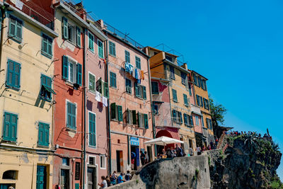 Low angle view of residential buildings against blue sky