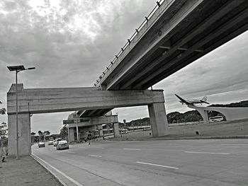 Bridge over highway against sky