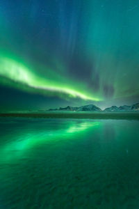 Scenic view of sea against sky at night