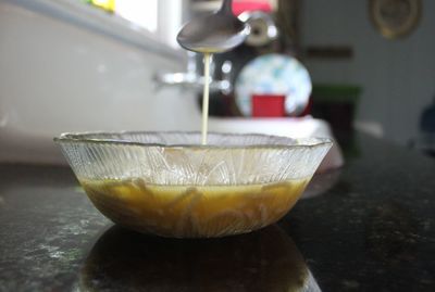 Close-up of pouring coffee in kitchen