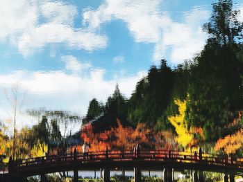 Panoramic shot of bridge over lake against sky