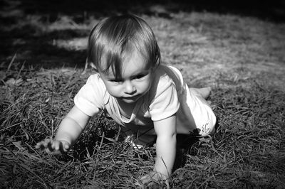 Boy playing on grassy field