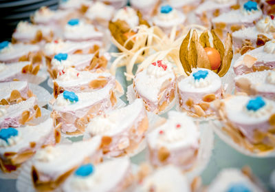 Close-up of cupcakes and winter cherry in plate