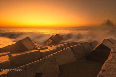 Scenic view of sea at sunset