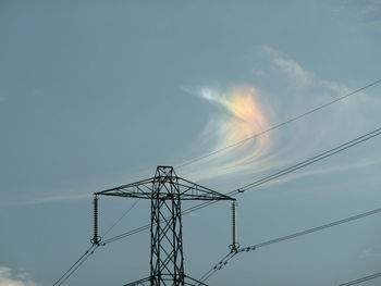 Low angle view of electricity pylon against sky