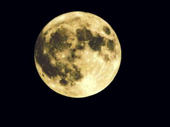 Low angle view of moon against sky at night