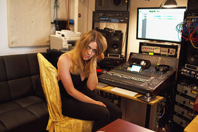 Young woman at a recording studio