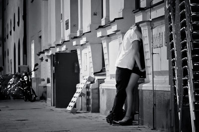 Romantic couple against the wall