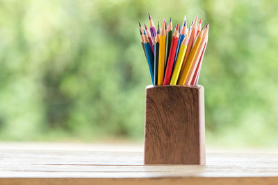 Close-up of colored pencils on table