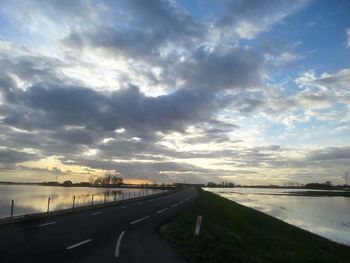 View of road against cloudy sky