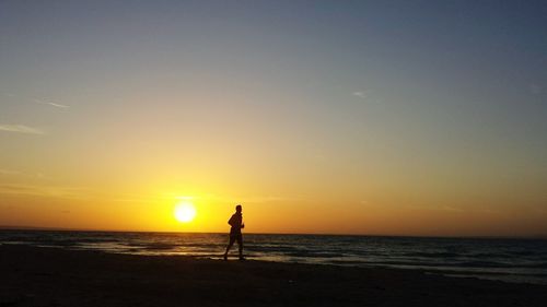 Scenic view of sea at sunset