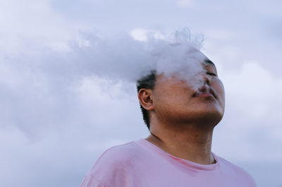 Close-up of man against sky